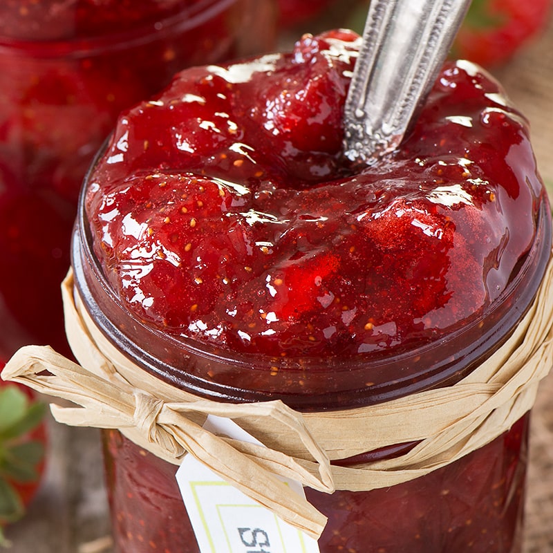 Easy to make, homemade strawberry jam with extra tips for using frozen strawberries, what to do if you don't have a sugar thermometer and what to do if your jam doesn't set.