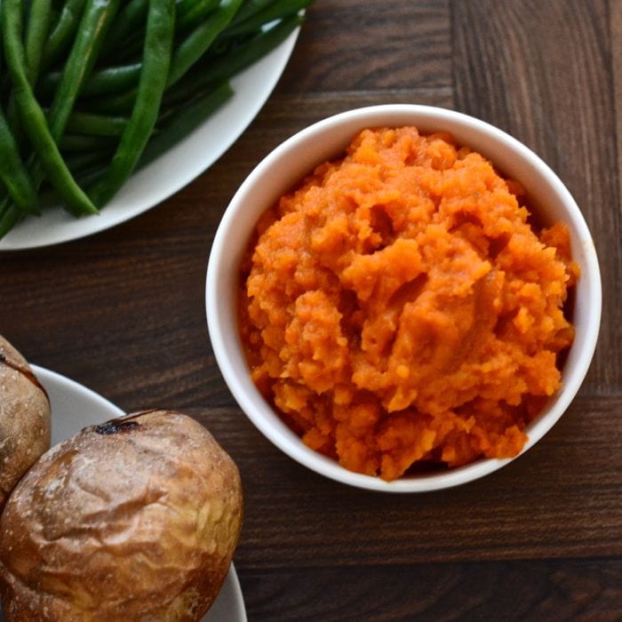 Roasting the vegetables really brings out the flavour in this carrot and swede mash recipe. The perfect accompaniment to a roast dinner and two of your five-a-day.