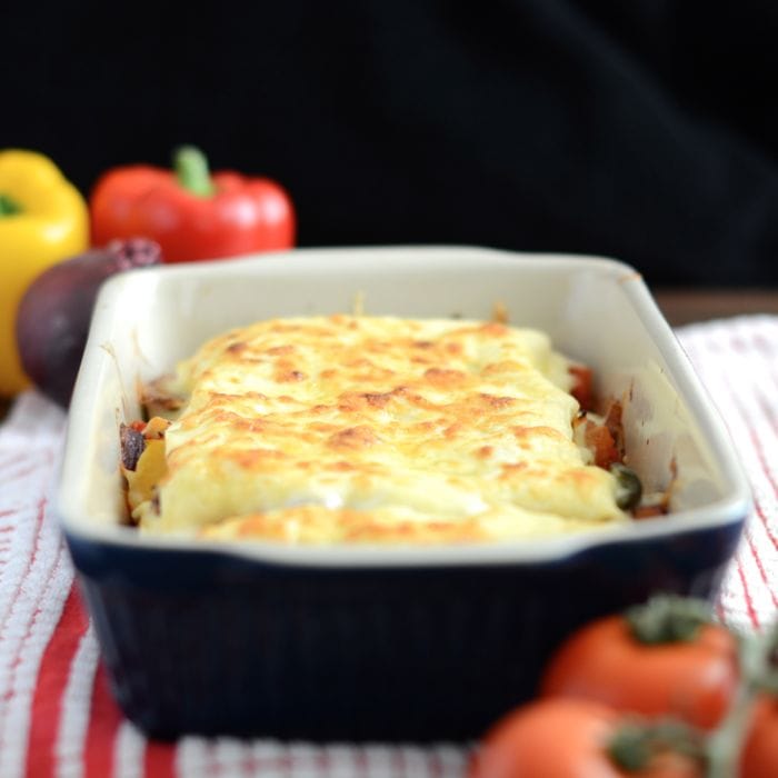 My delicious vegetarian lasagne recipe. Crammed full of roasted peppers, tomatoes and onions, and plenty of creamy homemade bechamel sauce and cheese.