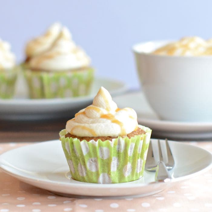 Caramel Macchiato Cupcakes - Delicious coffee sponge with a hidden caramel centre, topped with whipped vanilla cream and drizzled with a bit more caramel.
