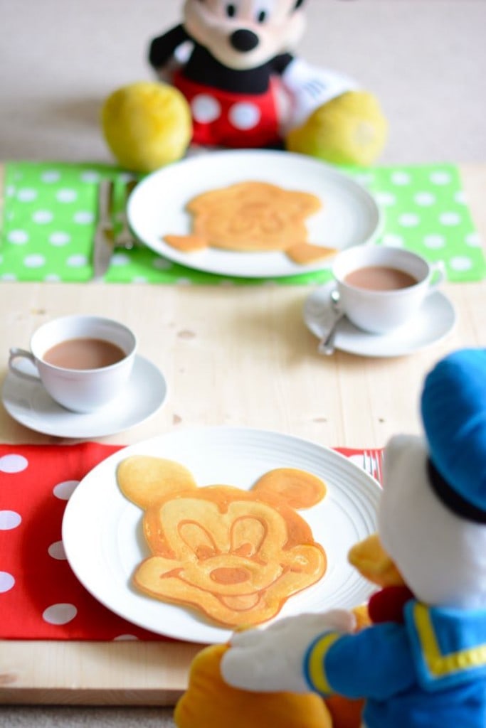 Mickey Mouse and Donald enjoying some mickey mouse pancake art for breakfast
