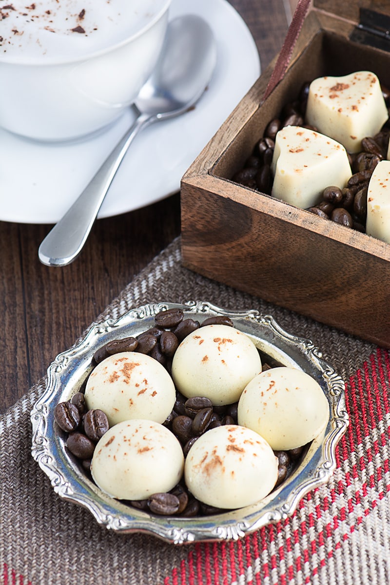 Cappuccino truffles - A soft milk chocolate and coffee ganache centre, coated in white chocolate and sprinkled with a little cocoa powder.
