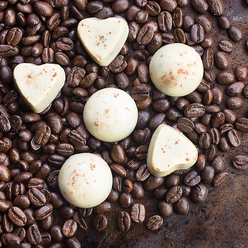 Cappuccino truffles - A soft milk chocolate and coffee ganache centre, coated in white chocolate and sprinkled with a little cocoa powder.