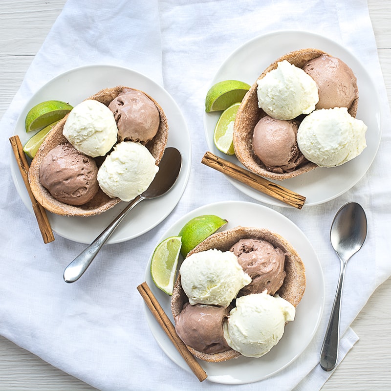 A delicious and surprisingly simple Mexican inspired dessert - Crisp sweet cinnamon taco bowls with Mexican hot chocolate (chocolate and cinnamon) and Margarita (lime, Tequila and orange liqueur) ice creams.