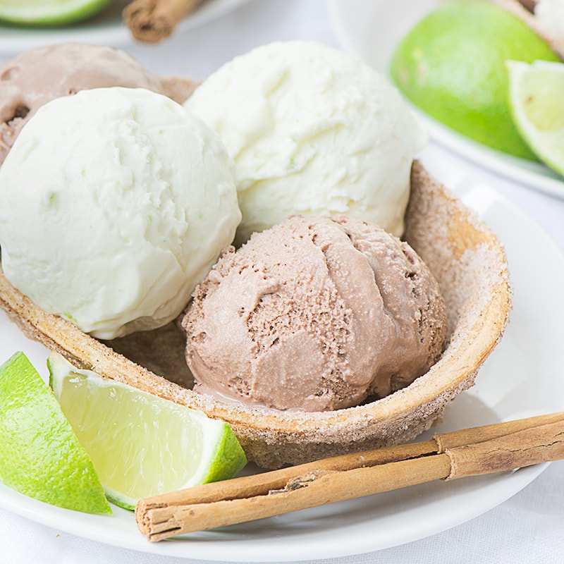 A delicious and surprisingly simple Mexican inspired dessert - Crisp sweet cinnamon taco bowls with Mexican hot chocolate (chocolate and cinnamon) and Margarita (lime, Tequila and orange liqueur) ice creams.