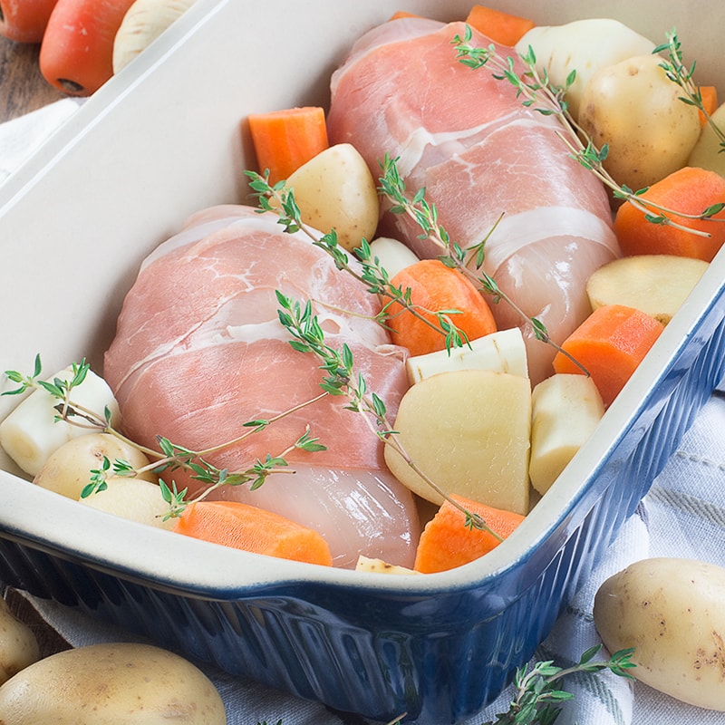 A complete roast dinner with only 10 minutes of preparation, ready in under an hour and using just one tray (so hardly any washing up). Chicken wrapped in parma ham with potatoes, parsnips, carrots, peas and even the gravy!