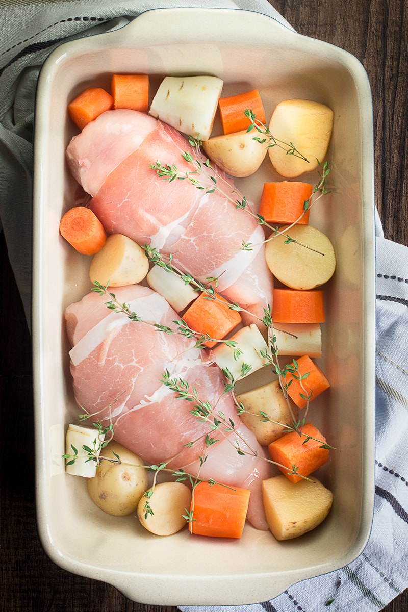 A complete roast dinner with only 10 minutes of preparation, ready in under an hour and using just one tray (so hardly any washing up). Chicken wrapped in parma ham with potatoes, parsnips, carrots, peas and even the gravy!