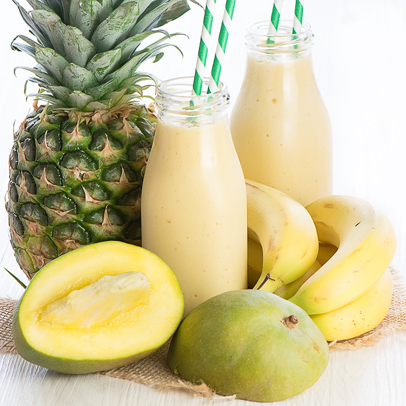 A delicious refreshing smoothie with coconut milk, banana, mango and pineapple.