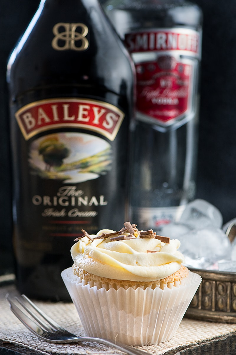 White Russian Cupcakes inspired by the classic cocktail - Baileys whipped cream sponge, topped with a White Russian buttercream and a hidden dark chocolate and vodka ganache centre.