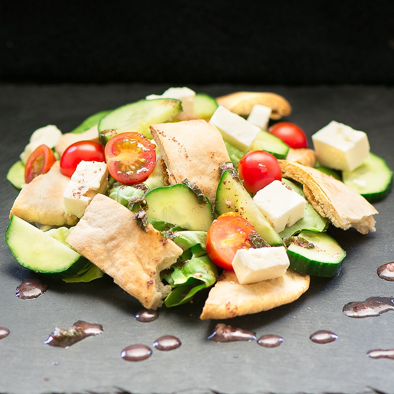 Fattoush Salad - A delicious summer salad with crispy pitta bread, feta cheese and a lemon, mint and sumac dressing.