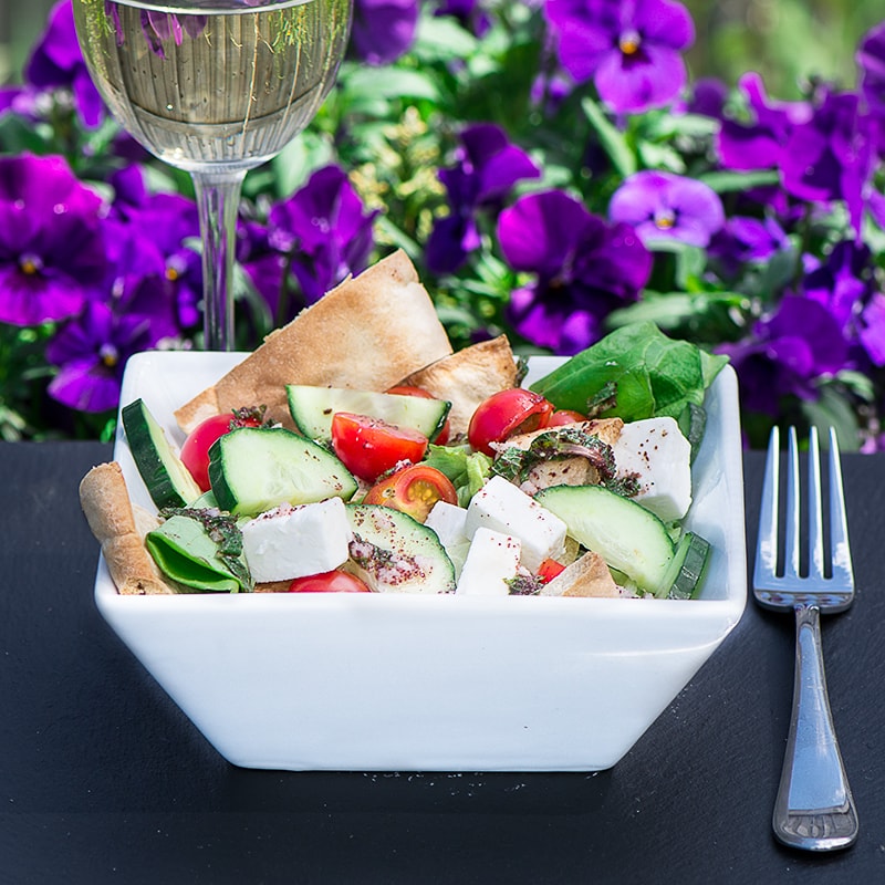 Fattoush Salad - A delicious summer salad with crispy pitta bread, feta cheese and a lemon, mint and sumac dressing.