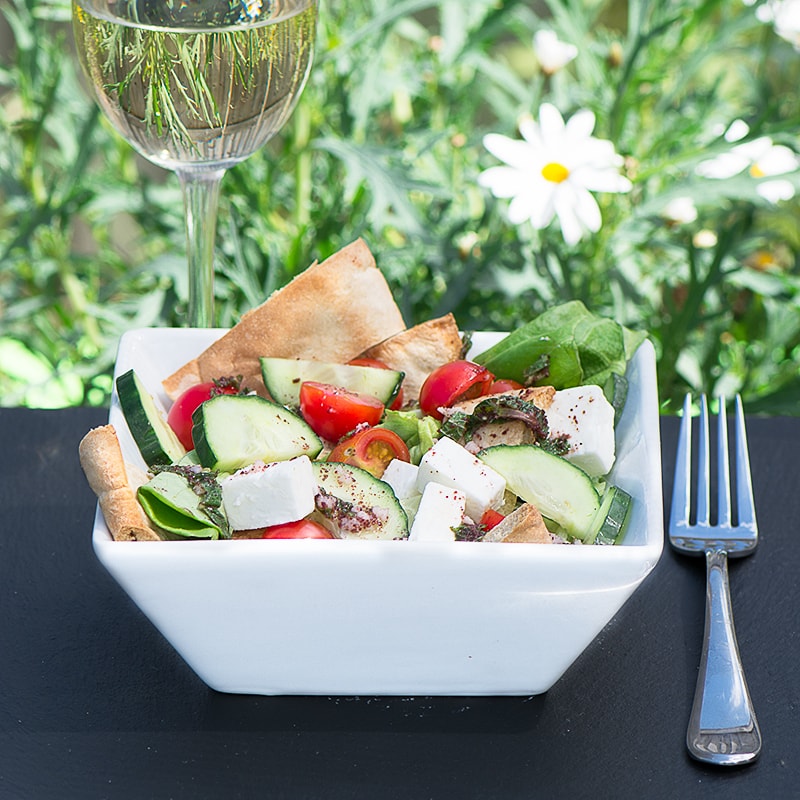 Fattoush Salad - A delicious summer salad with crispy pitta bread, feta cheese and a lemon, mint and sumac dressing.