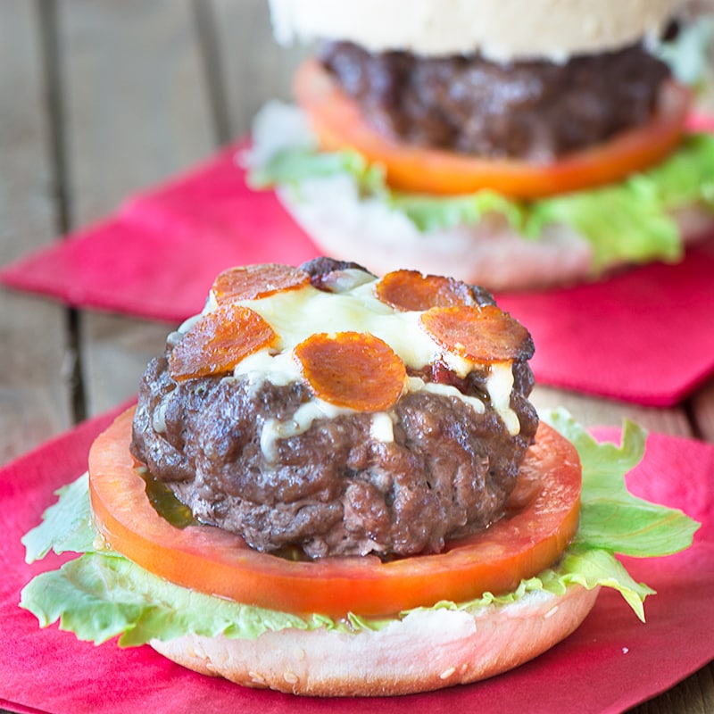 Take your homemade burgers to the next level with these juicy beef burgers topped with tomato sauce, cheese and slices of pepperoni.