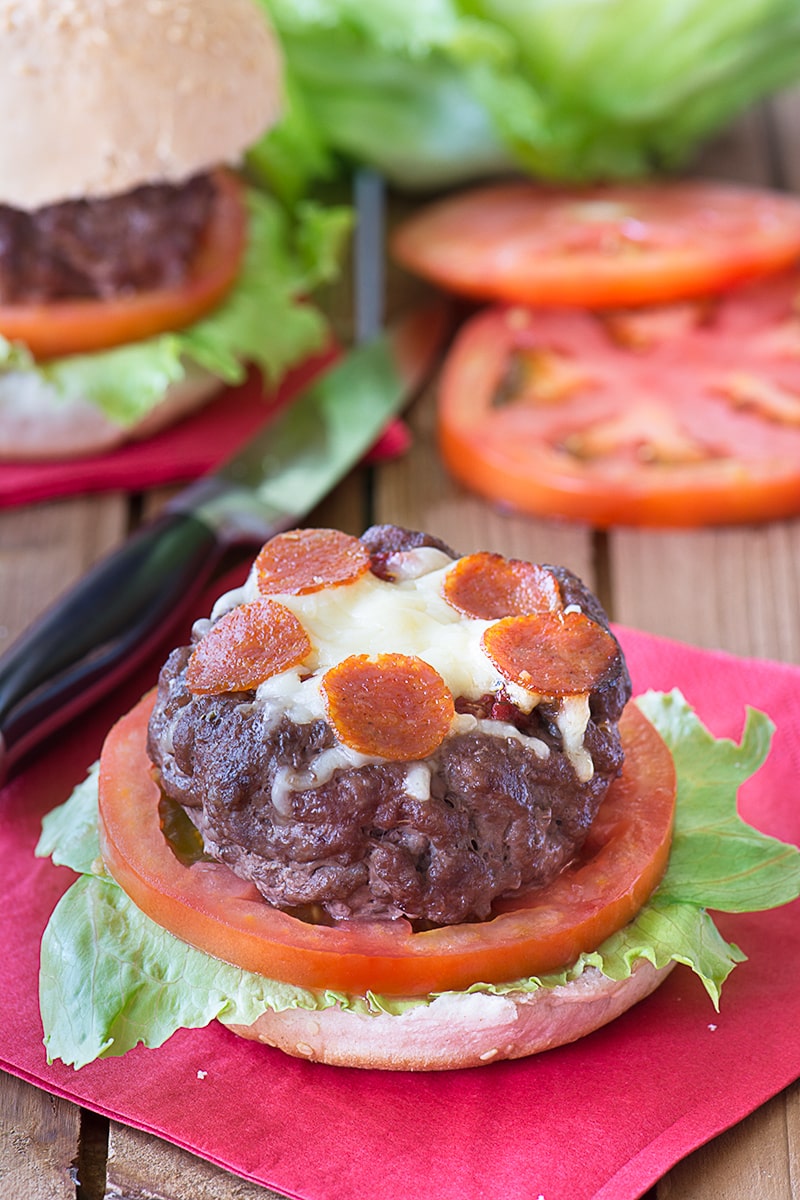 Take your homemade burgers to the next level with these juicy beef burgers topped with tomato sauce, cheese and slices of pepperoni.
