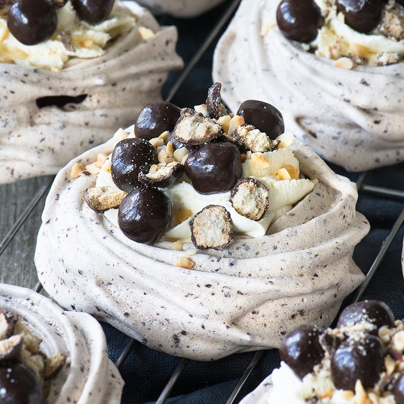 Crisp, yet chewy, chocolate meringue topped with whipped cream, chocolate digestive nibbles and hazelnuts.