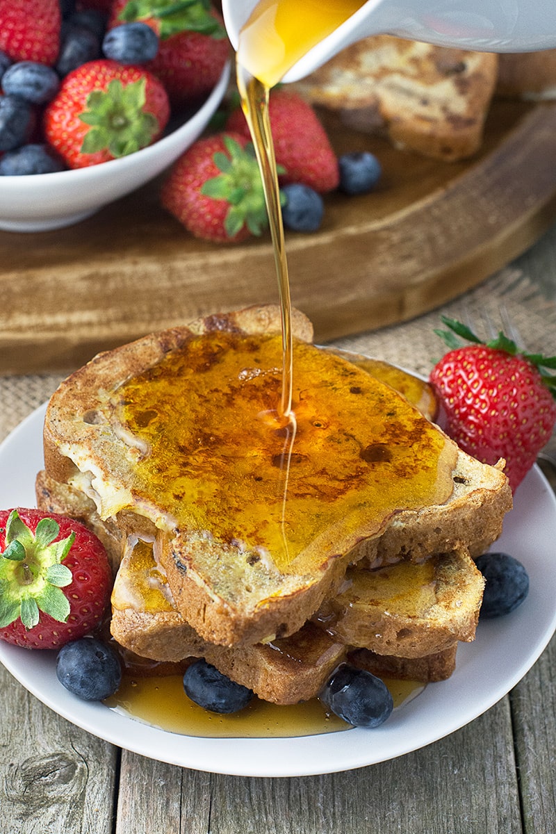 A twist on traditional french toast made with fruit bread and with added orange zest. Perfect for breakfast served with maple syrup and fresh fruit.