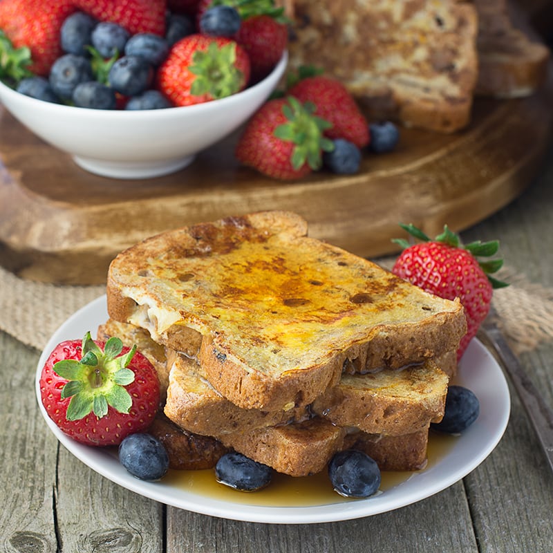 A twist on traditional french toast made with fruit bread and with added orange zest. Perfect for breakfast served with maple syrup and fresh fruit.