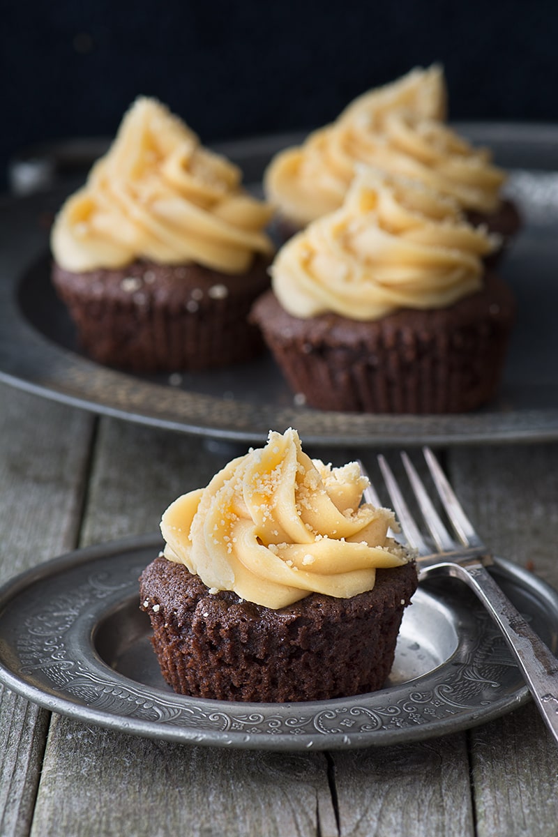 Millionaires' Cupcakes - Chocolate cupcakes topped with caramel buttercream with a hidden shortbread and caramel centre.