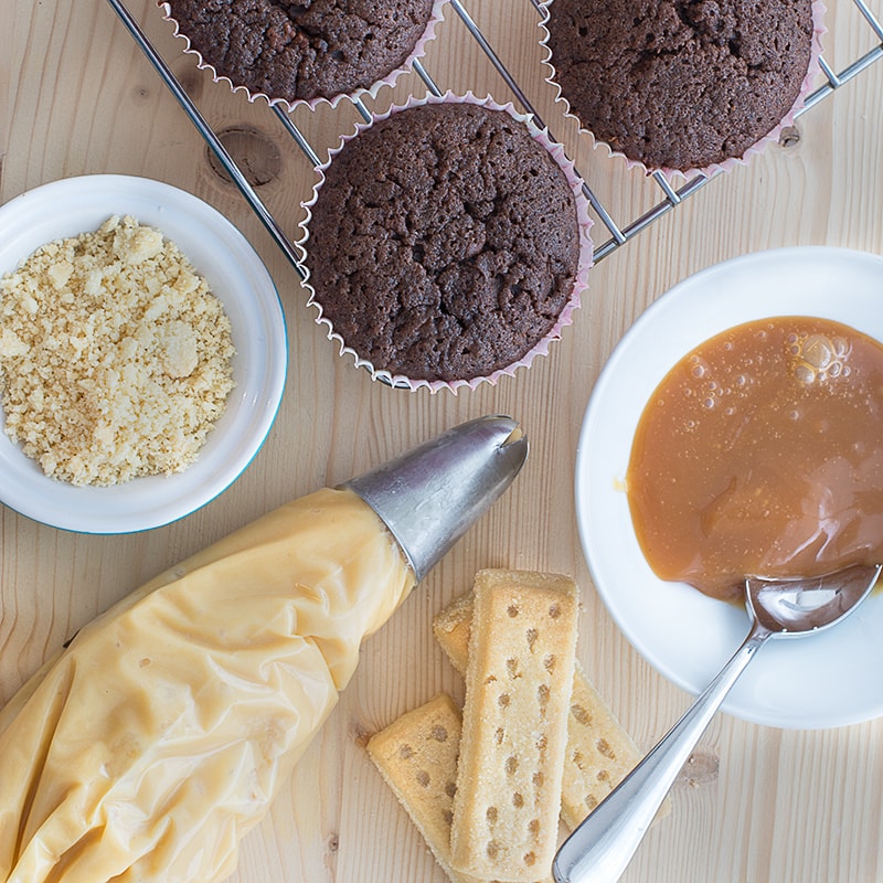 Millionaires' Cupcakes - Chocolate cupcakes topped with caramel buttercream with a hidden shortbread and caramel centre.