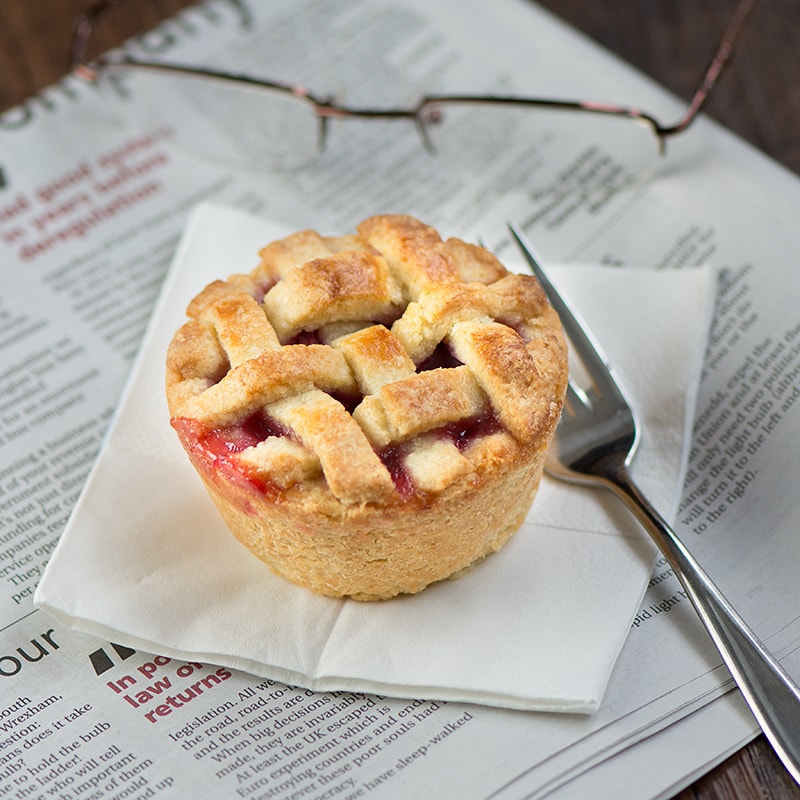 Homemade cherry pies with a pretty lattice top - crisp almond pastry, filled with juicy cherries. Perfect for a summer picnic or with a scoop of icecream for dessert.
