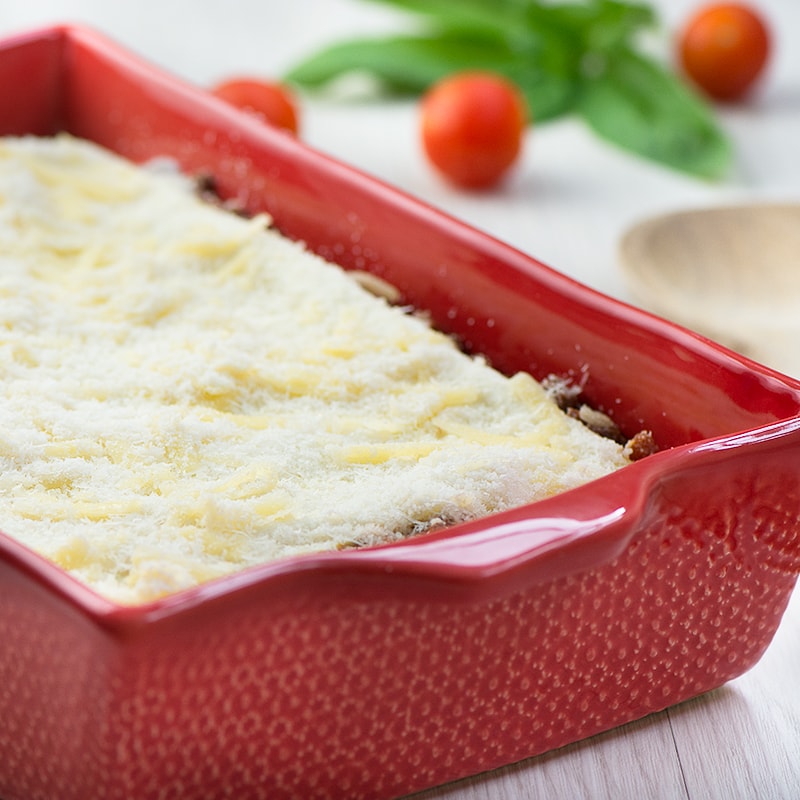 Delicious beef lasagne - layers of pasta filled with a rich beef bolognese, creamy béchamel sauce and plenty of grated cheese.