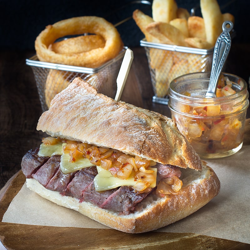 Juicy sirloin steak topped with cheddar cheese and an easy homemade spicy onion relish, served in crusty ciabatta.