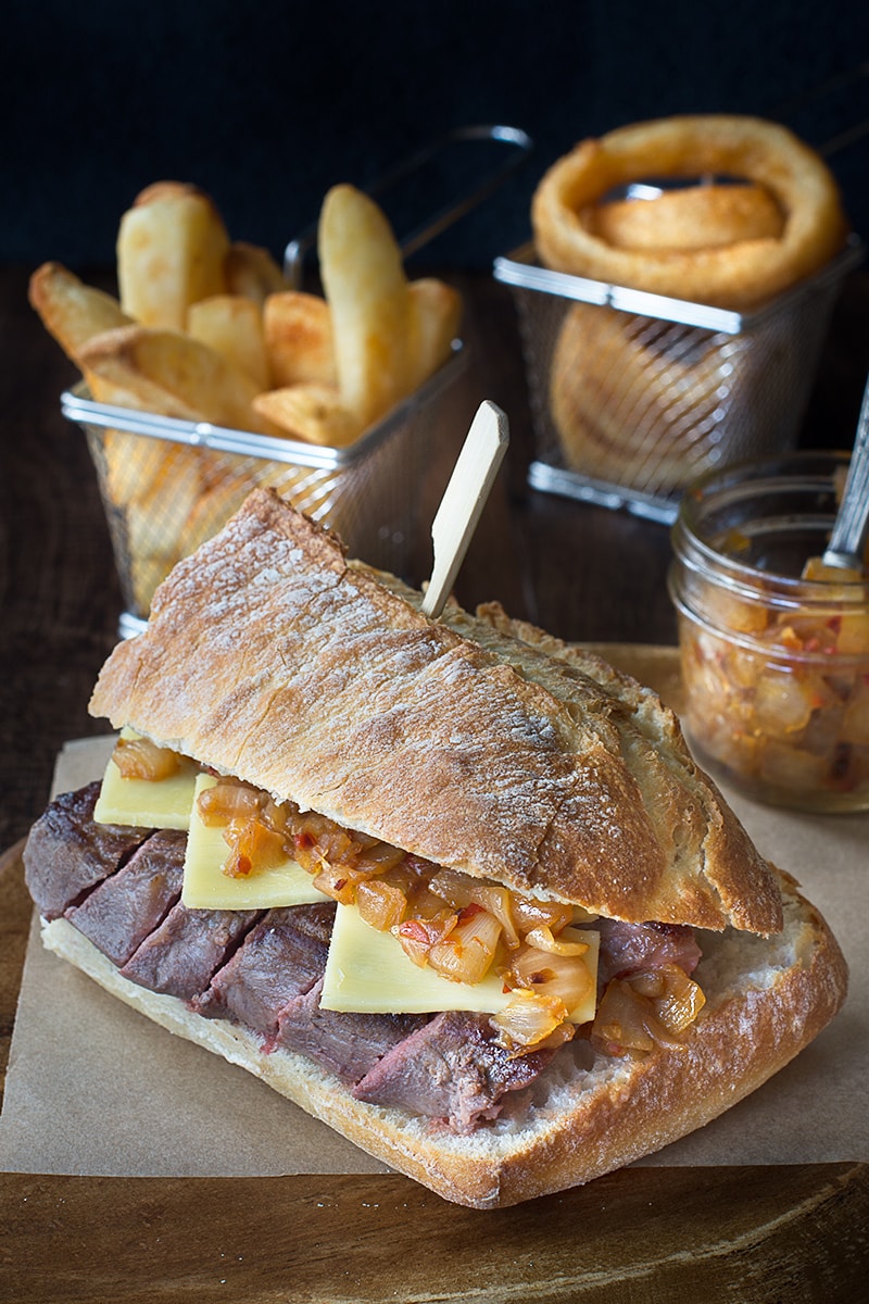 Juicy sirloin steak topped with cheddar cheese and an easy homemade spicy onion relish, served in crusty ciabatta.