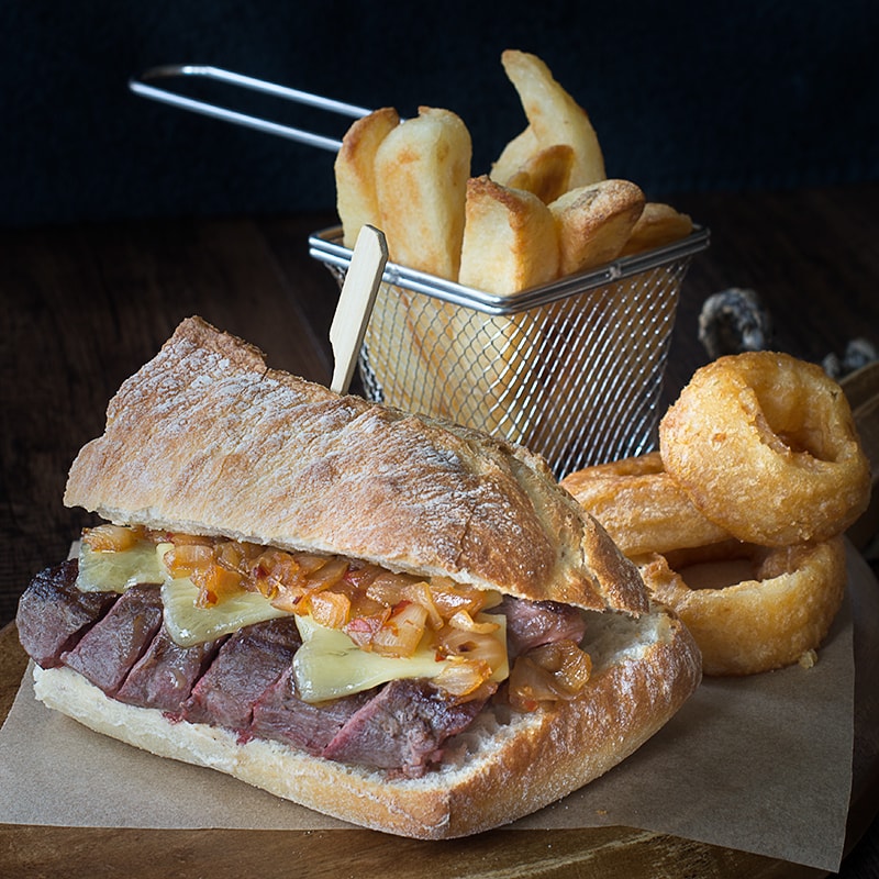 Juicy sirloin steak topped with cheddar cheese and an easy homemade spicy onion relish, served in crusty ciabatta.