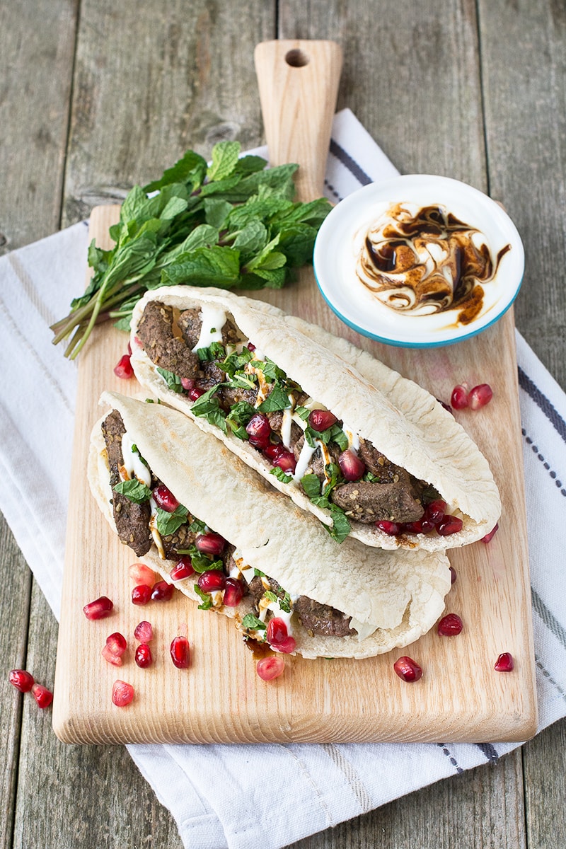 Za'atar lamb pittas with pomegranate and mint, ready in just 5 minutes, the perfect quick and tasty lunch.