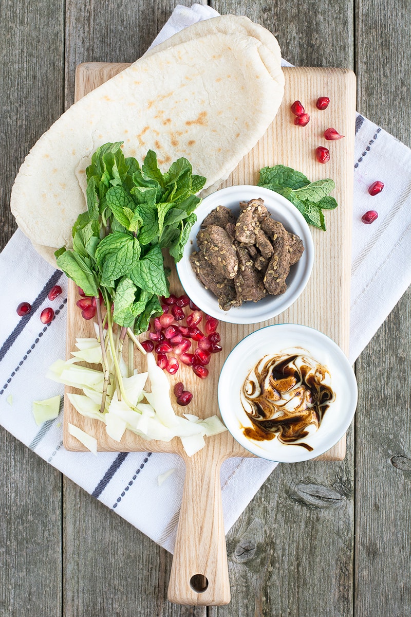 Za'atar lamb pittas with pomegranate and mint, ready in just 5 minutes, the perfect quick and tasty lunch.