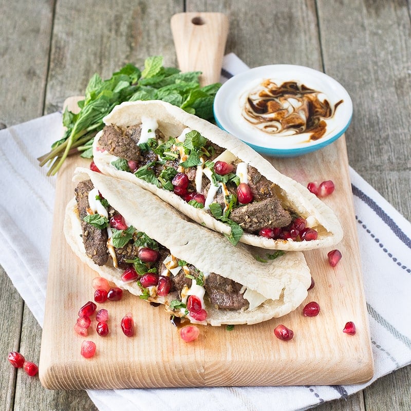 Za'atar lamb pittas with pomegranate and mint, ready in just 5 minutes, the perfect quick and tasty lunch.