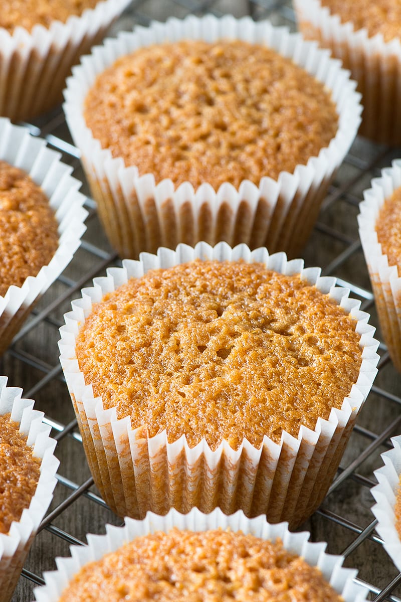 Caramel cupcakes on a cooling rack.