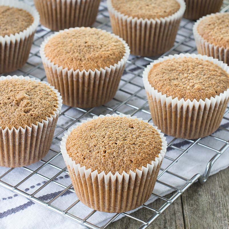 Freshly baked coffee cupcakes on a cooling rack.