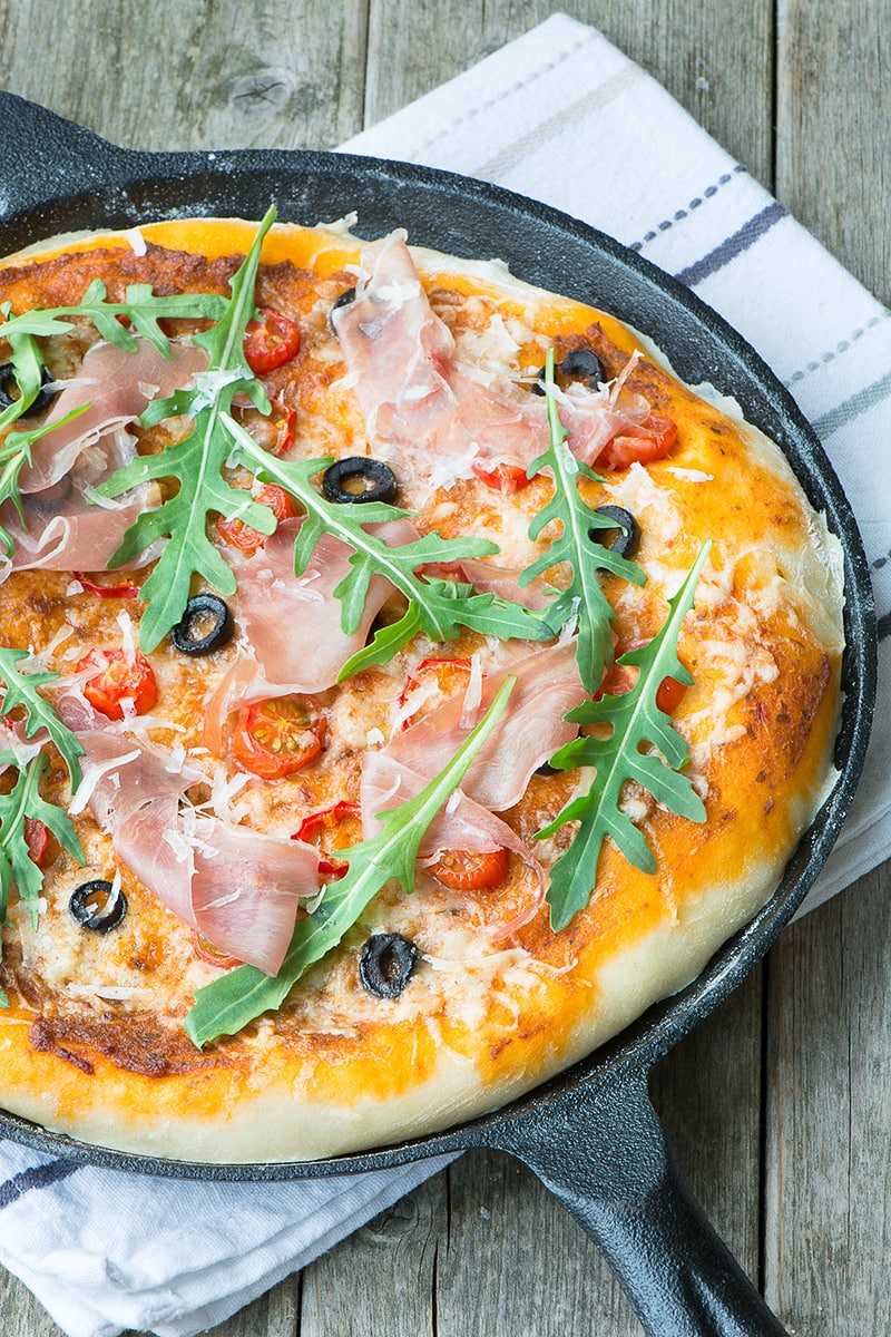 A delicious homemade pizza topped with sun dried tomato pesto, olives, chillies and Grana Padano cheese and then finished with Prosciutto di San Daniele and rocket.