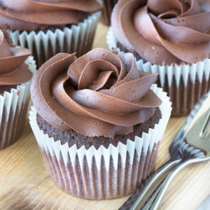 Dairy-free chocolate cupcakes topped with dairy-free chocolate buttercream.