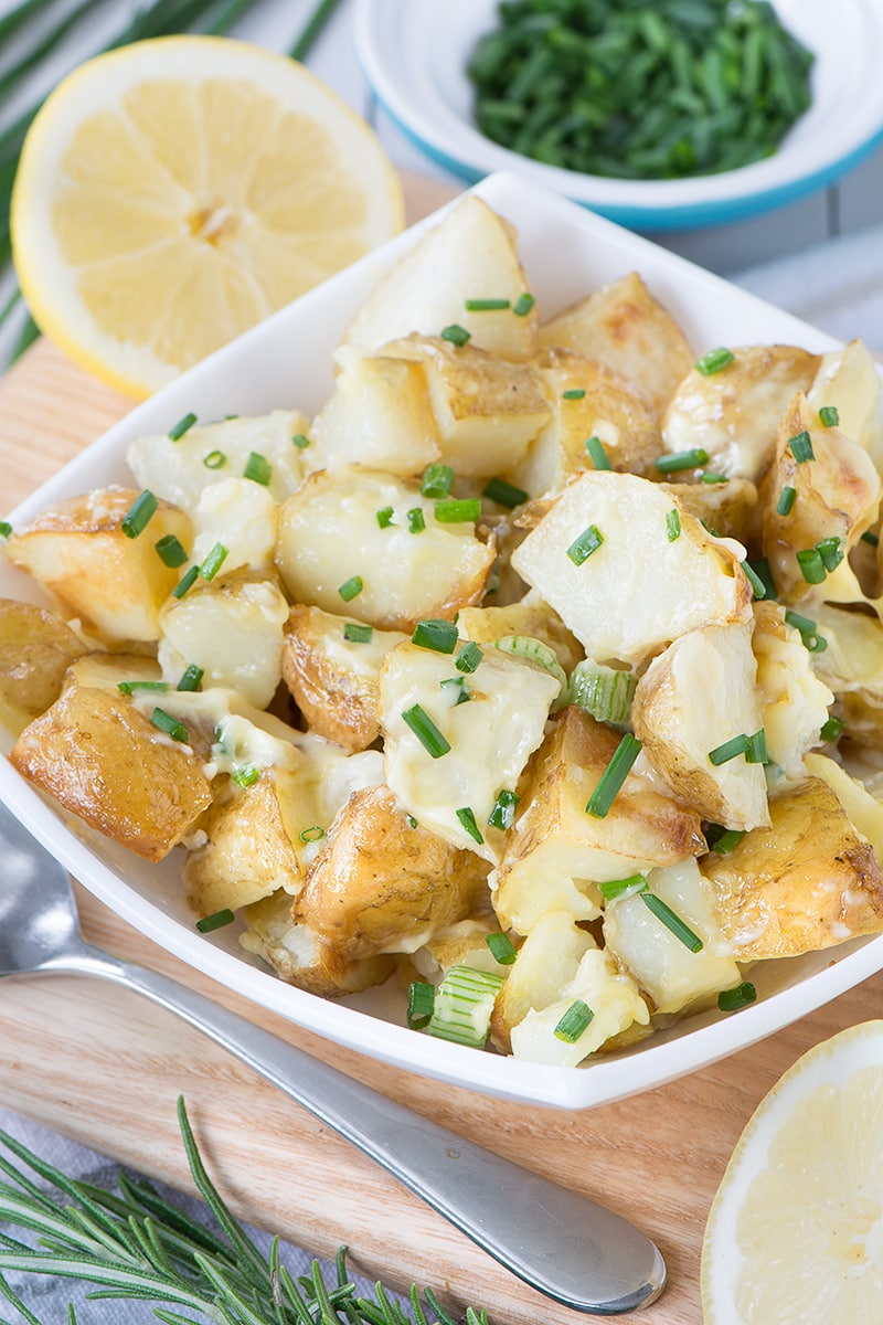 Roasting the potatoes for this potato salad with garlic and herbs means it's full of flavour, especially when you add homemade mayonnaise too. It's perfect for a summer barbecue or picnic.