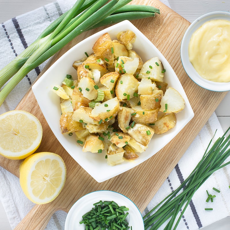 Roasting the potatoes for this potato salad with garlic and herbs means it's full of flavour, especially when you add homemade mayonnaise too. It's perfect for a summer barbecue or picnic.