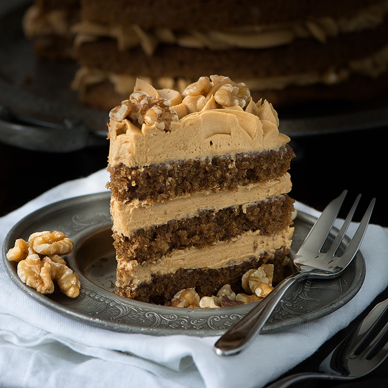 My recipe for a classic Coffee & Walnut Cake. Three layers of delicious coffee sponge packed full of chopped walnuts and topped with smooth coffee buttercream.
