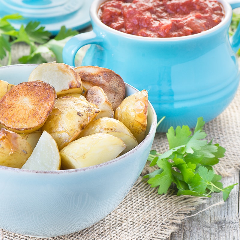 Delicious garlic roasted potatoes in a rich tomato sauce flavoured with smoked paprika.