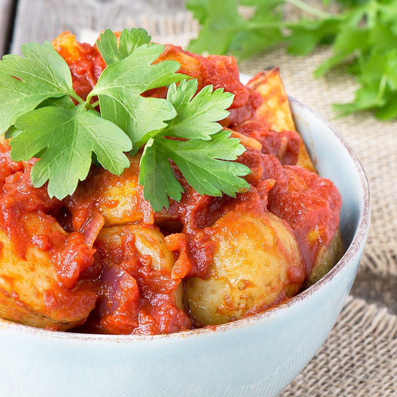 Delicious garlic roasted potatoes in a rich tomato sauce flavoured with smoked paprika.