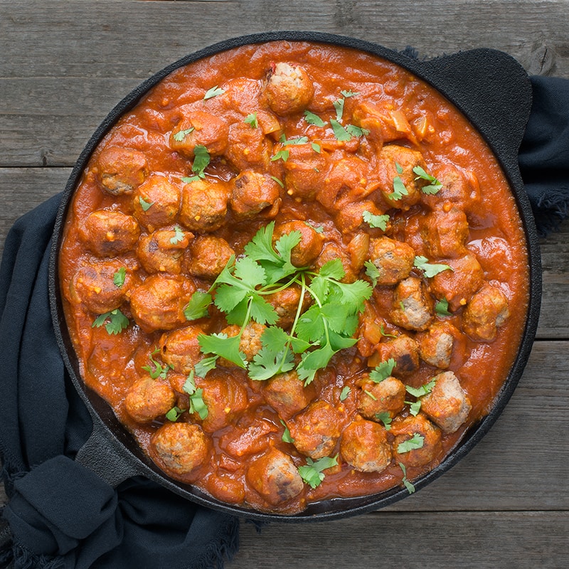 Delicious lamb meatballs in a spiced tomato sauce - perfect for a family meal or a curry tapas party.