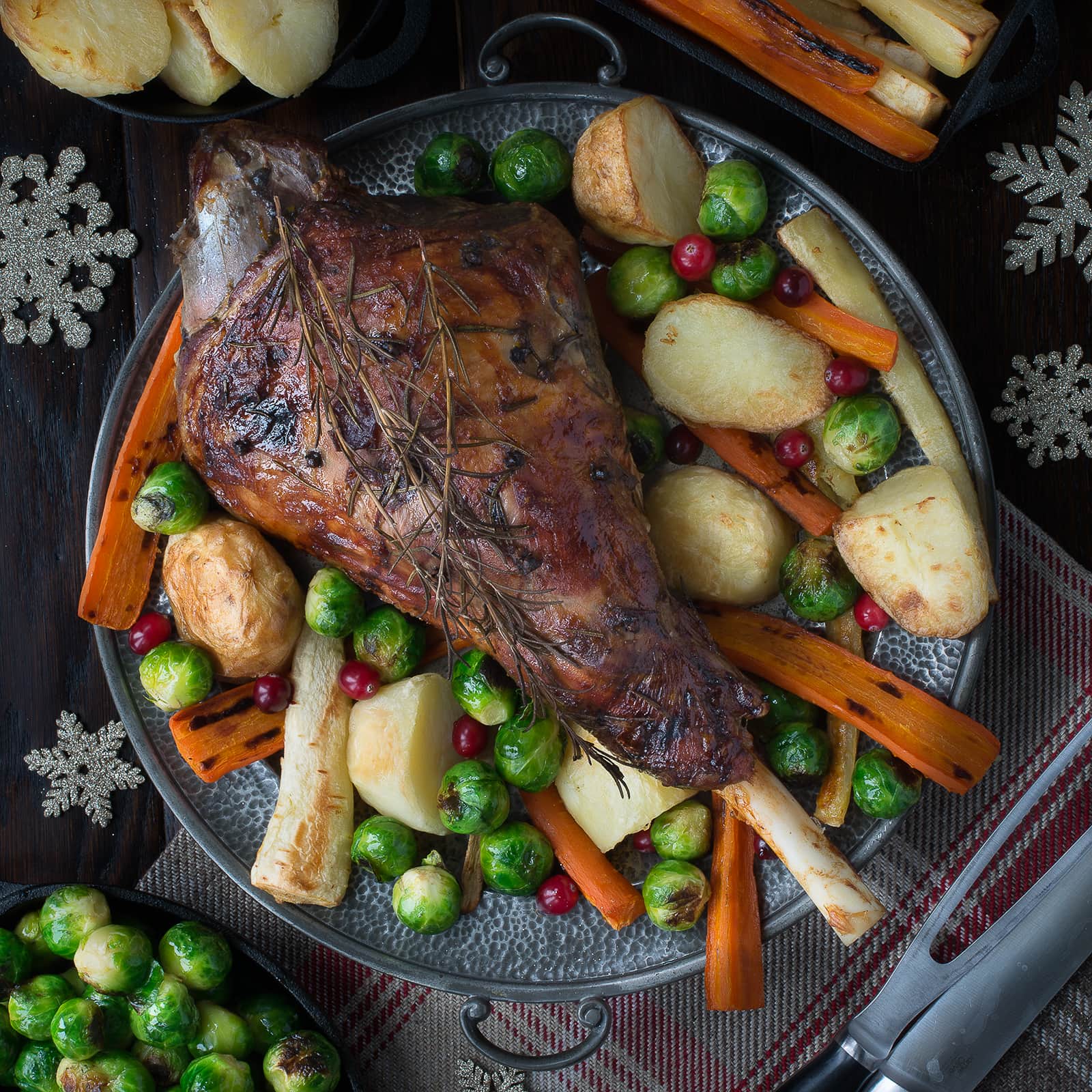 My festive roast leg of lamb flavoured with rosemary, cloves, orange and cranberries makes a fantastic alternative to turkey on Christmas day or to feed your family and friends over the festive period.