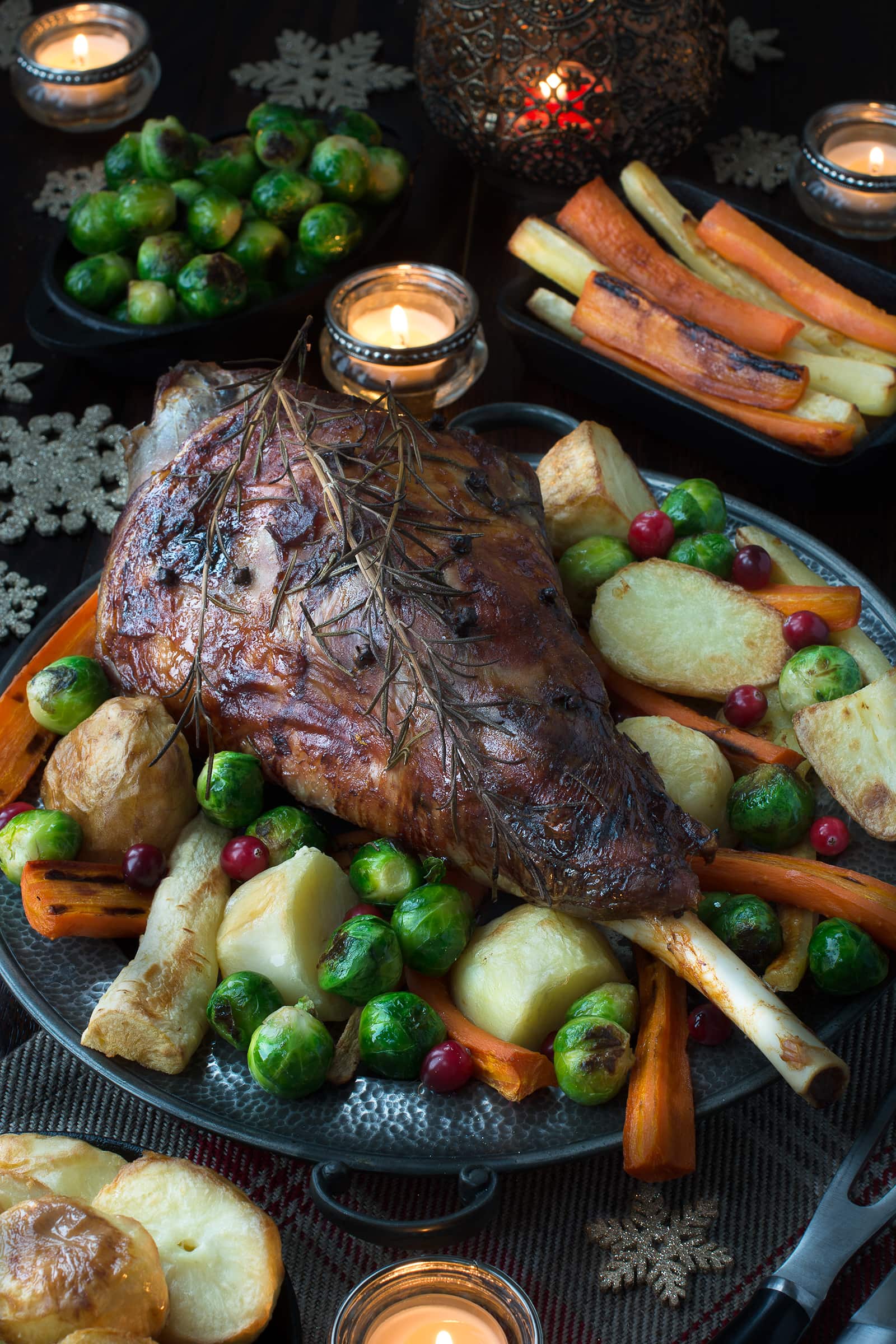 My festive roast leg of lamb flavoured with rosemary, cloves, orange and cranberries makes a fantastic alternative to turkey on Christmas day or to feed your family and friends over the festive period.