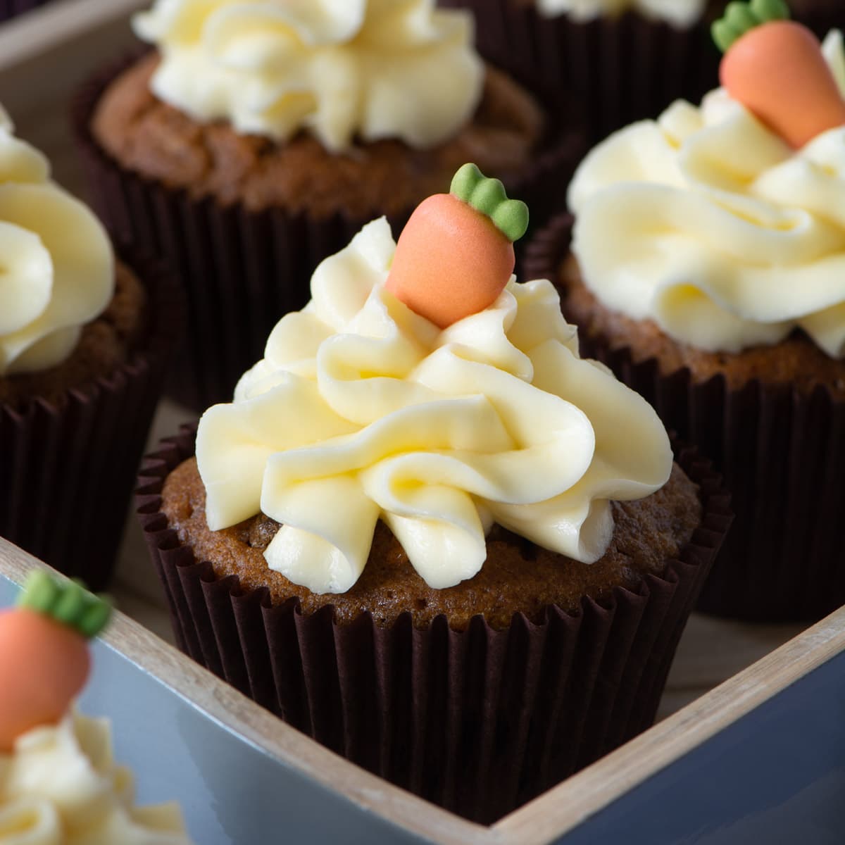 Carrot Cake Cupcakes - Delicious spiced carrot cake cupcakes topped with smooth cream cheese buttercream.