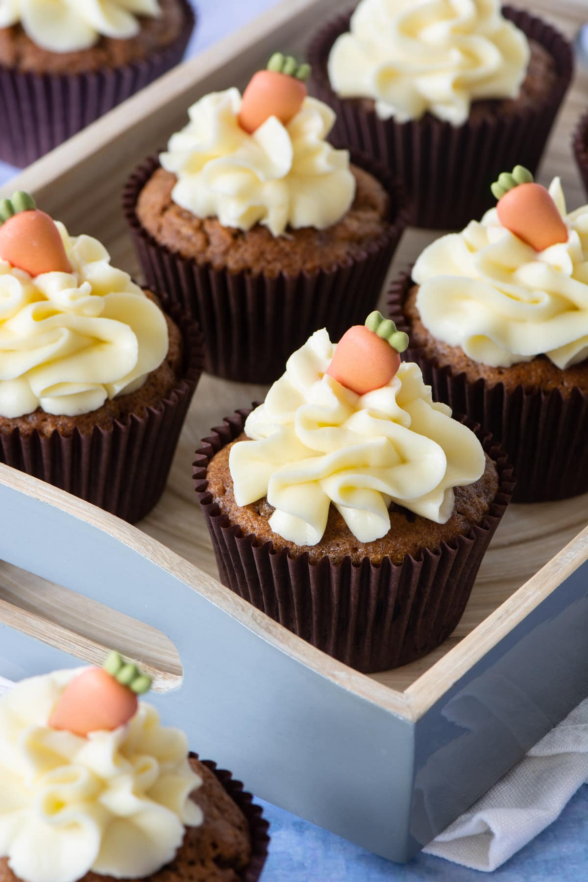 Carrot Cake Cupcakes - Delicious spiced carrot cake cupcakes topped with smooth cream cheese buttercream.