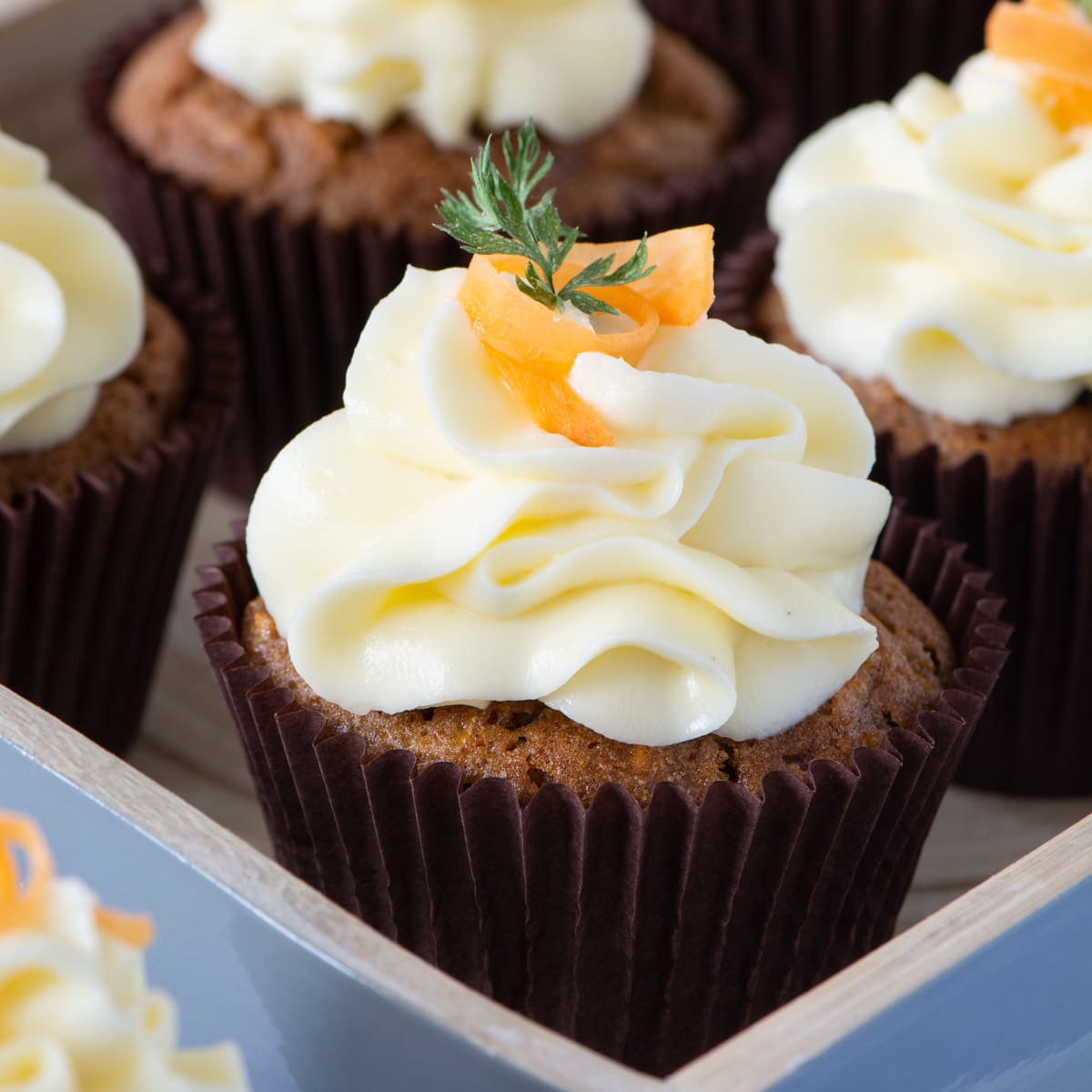 Carrot Cake Cupcakes - Delicious spiced carrot cake cupcakes topped with smooth cream cheese buttercream.