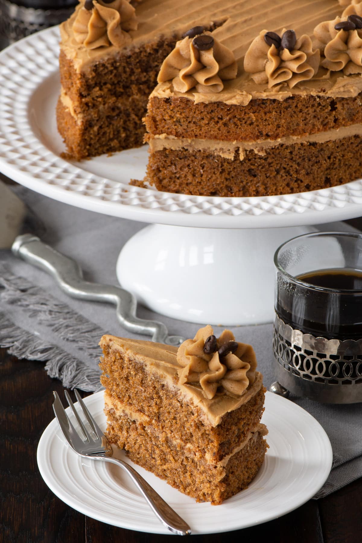 Easy Coffee Cake - A delicious all-in-one coffee sponge topped with smooth coffee buttercream. Simple to make and packed full of flavour. PLUS - How to make this cake in any size of round, square or rectangular tin. 