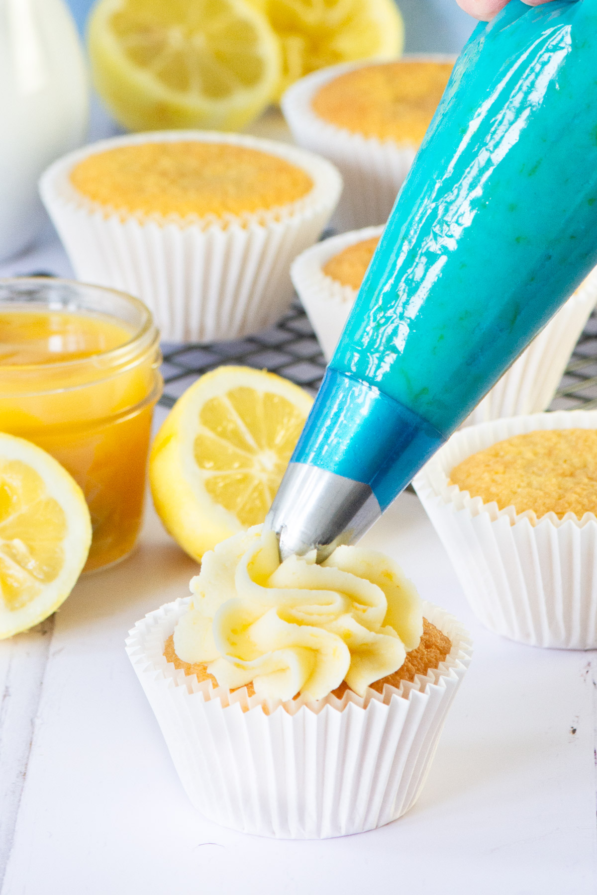 Two different versions of my delicious lemon buttercream - one made with fresh lemons (juice and zest) and another made with either lemon extract or oil. Perfect for decorating cakes and cupcakes or filling biscuits and macarons.