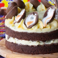 Creme Egg Cake. A chocolate sponge cake with white chocolate buttercream, topped with Creme Eggs.