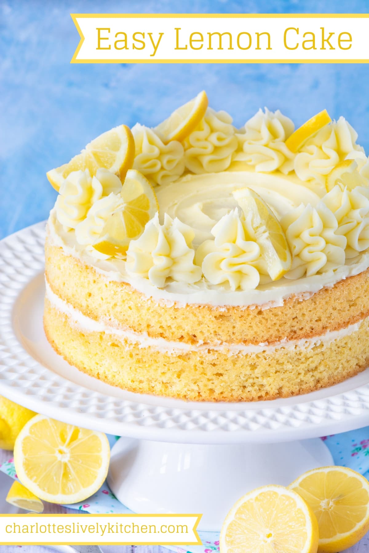 The finished lemon sponge cake. The cake is decorated with swirls is piped lemon buttercream and slices of lemon and is on a white cake stand. There is a title saying "Easy Lemon Cake" at the top of the image, making this image perfect for saving to Pinterest.